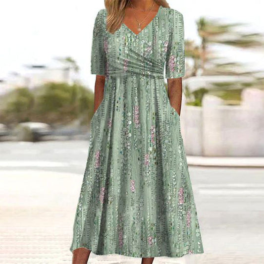 Robe mi-longue verte à imprimé végétal et poche latérale