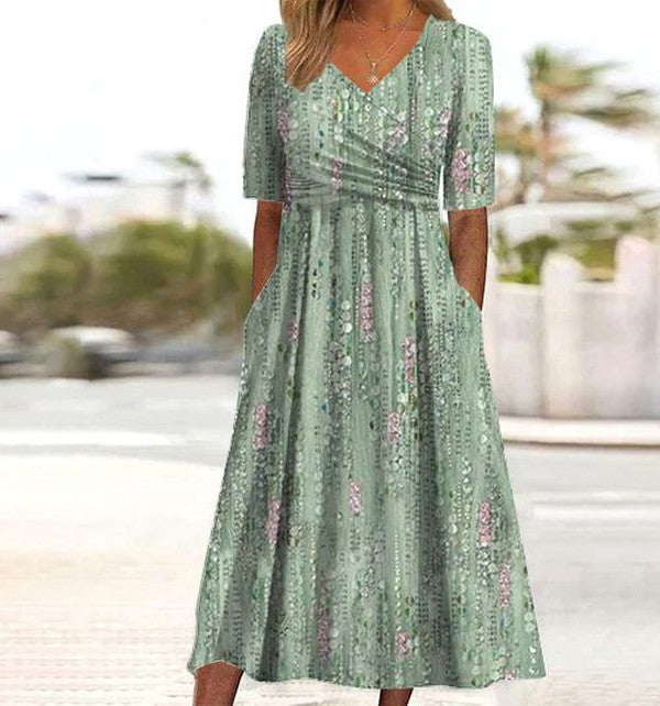 Robe mi-longue verte à imprimé végétal et poche latérale